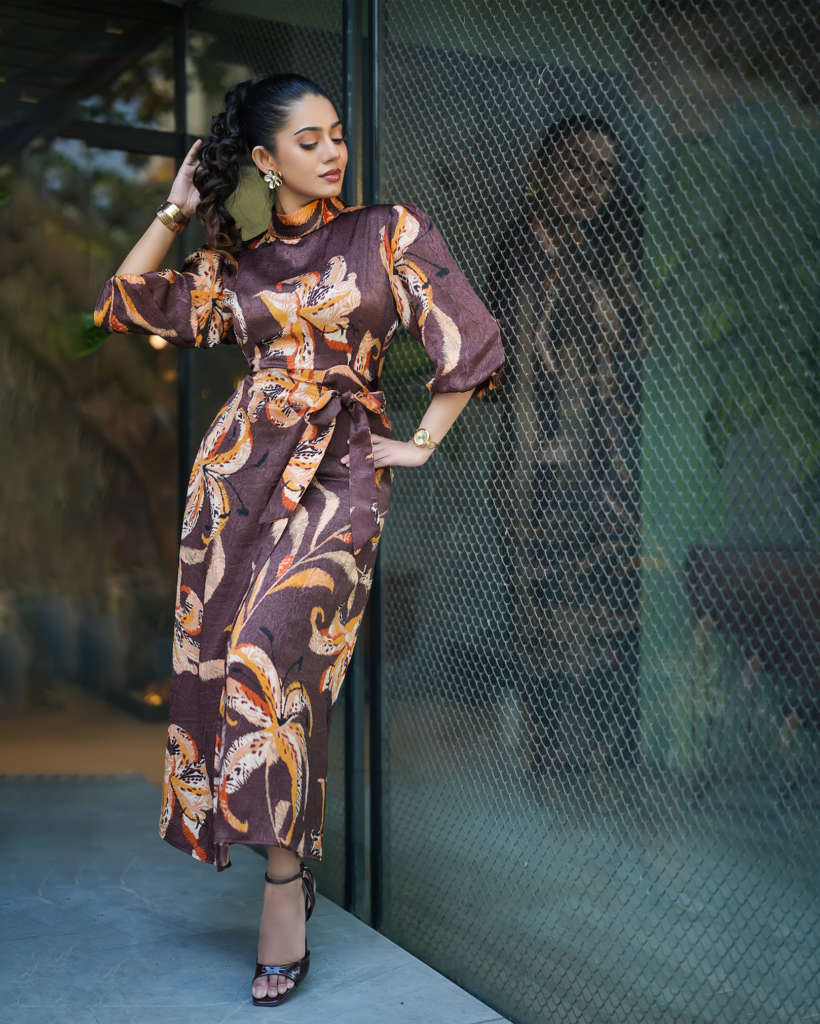 Model wearing ARIZA Plum Floral Belted Long Tunic with mustard and cream botanical motifs, balloon sleeves and a matching waist tie.